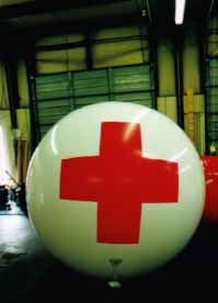 7' helium balloon with red cross for first-aid location. Giant helium balloons can be great markers at events and concerts.